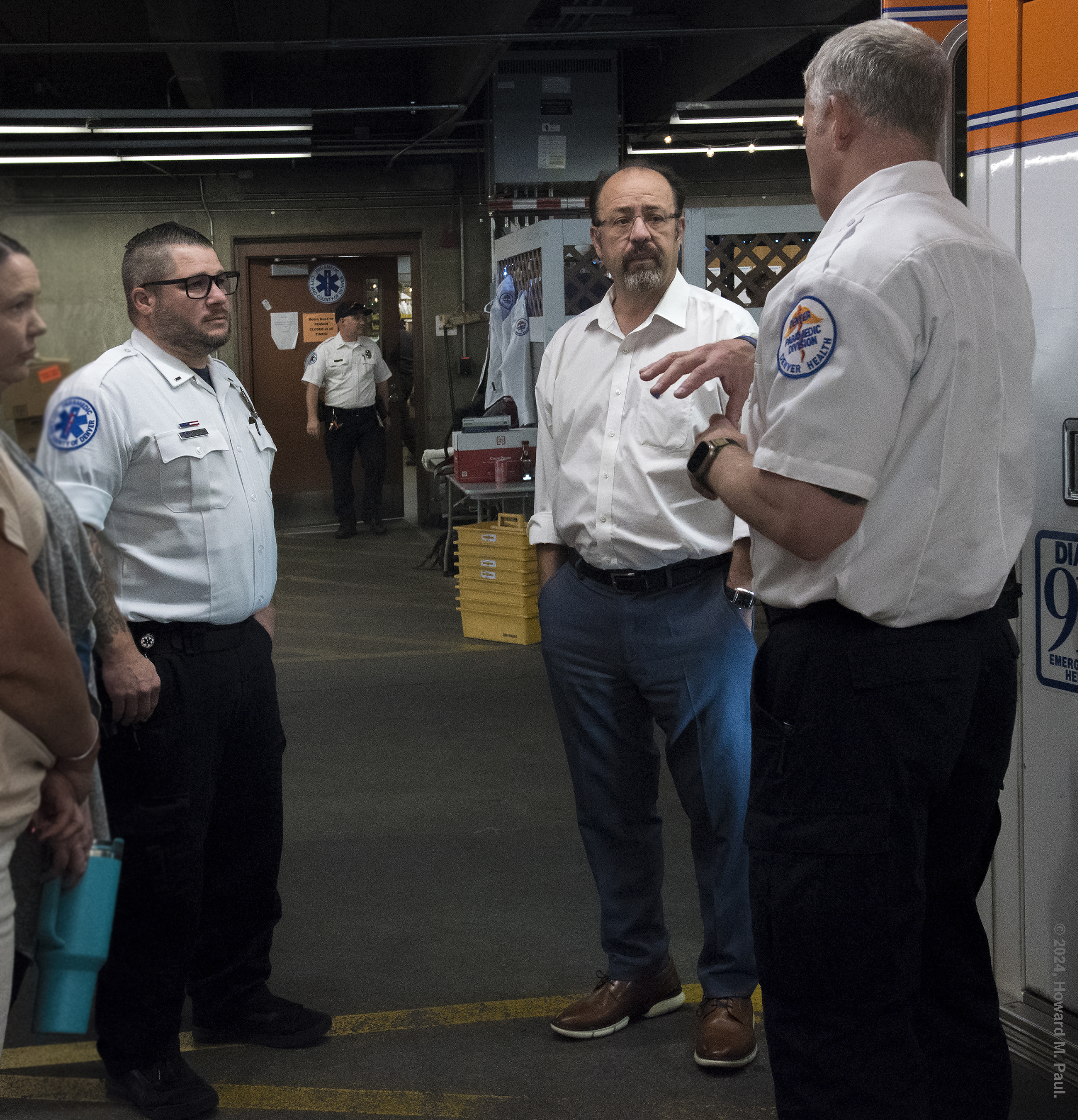 Denver Paramedic Divison Deputy Chief Brent Stevenson and Paramedic Lt. Matt Petersen brief Senator Rodriguez in the DH ambulance garage before heading to the streets
