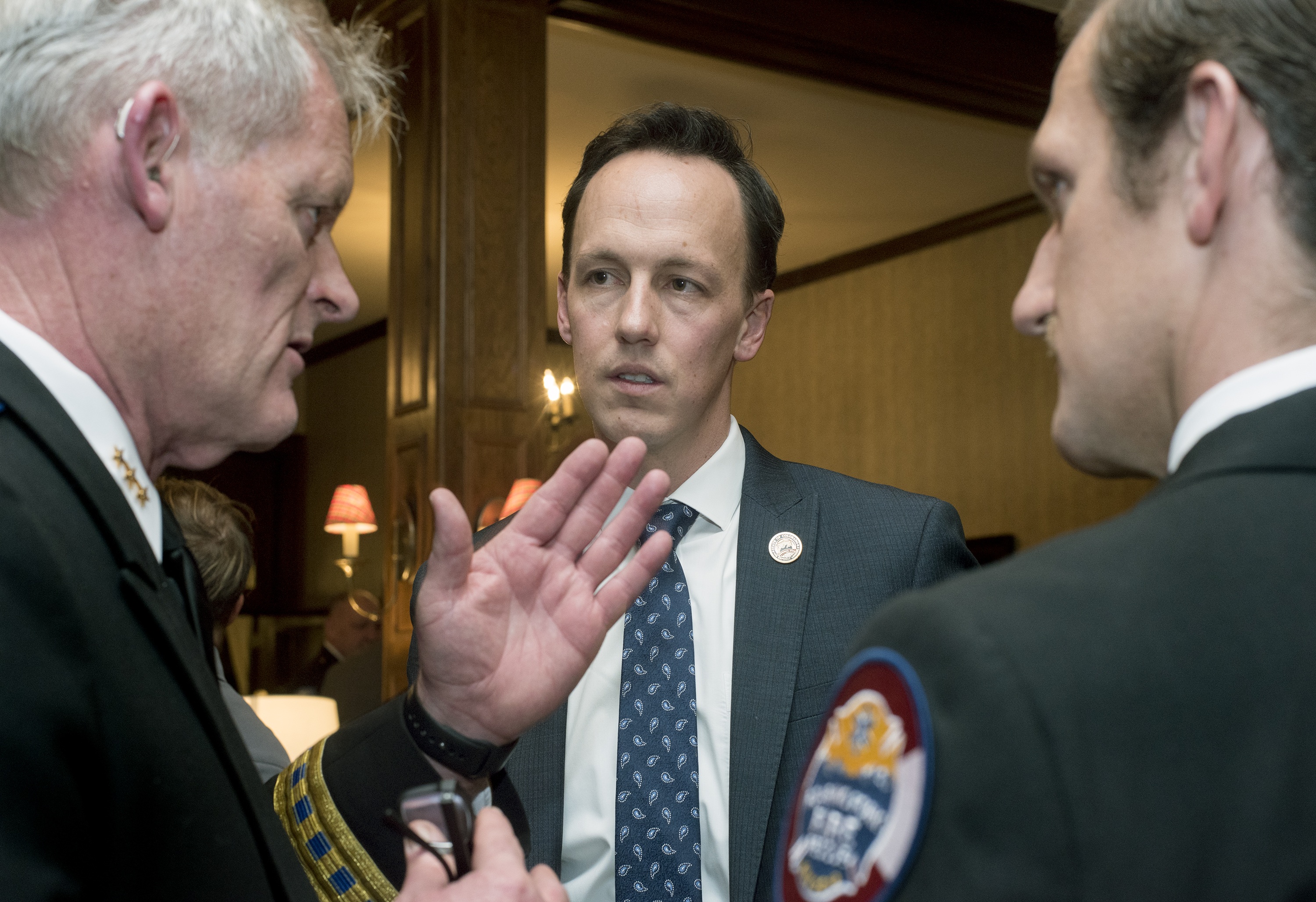 Ute Pass Regional EMS CEO Tim Dienst (L) and Roaring Fork Fire rescue EMS Chief Richard Cornelius discuss EMS issues with Senator Dylan Roberts.